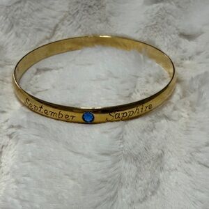 Vintage Gold Tone Bracelet w/ September and Sapphire inscribed. Inc a Blue Gem.